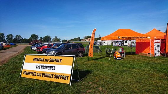 auto support orange gazebo A printed gazebo with a company logo at an outdoor event