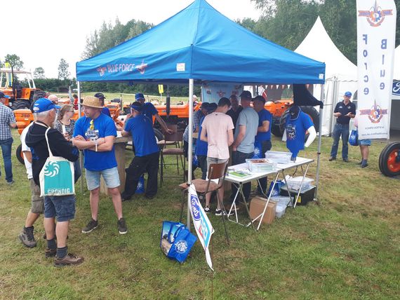 blue printed info gazebo A printed gazebo with a company logo at an outdoor event