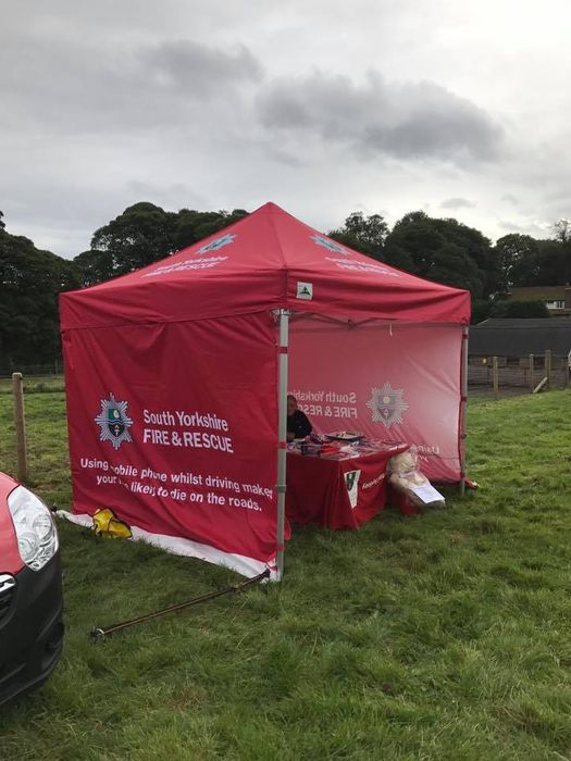 fire and rescue red printed gazebo A printed gazebo with a company logo at an outdoor event