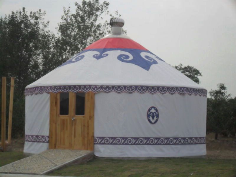 A mongolian themed yurt tent with a double wooden door