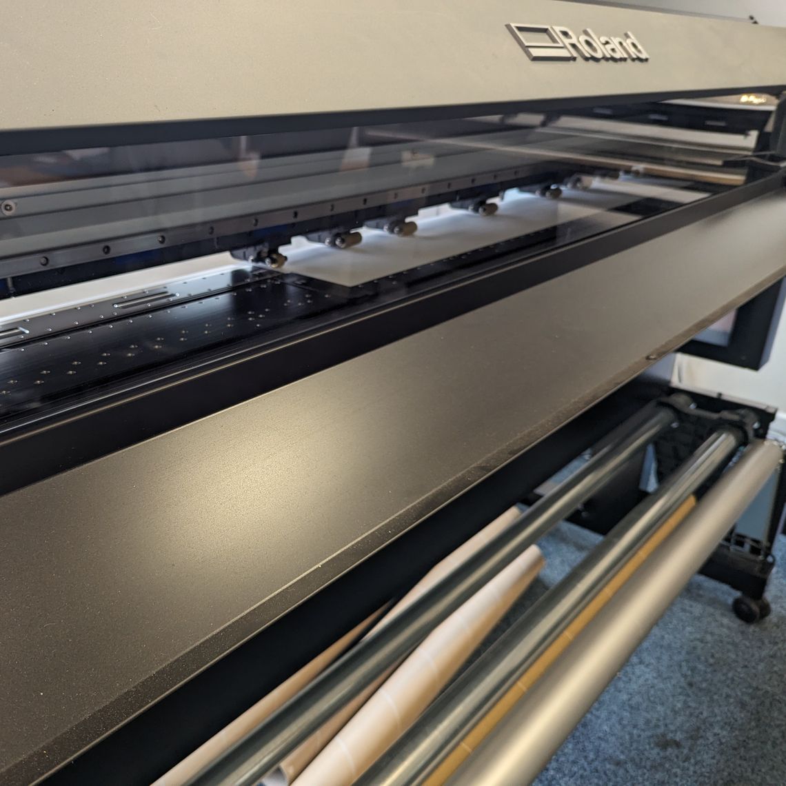 a close up of an industrial vinyl printer