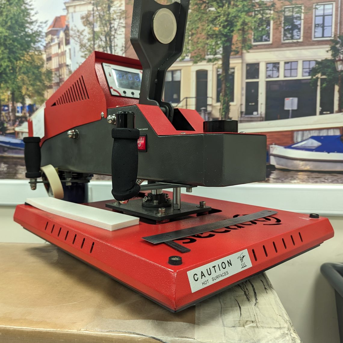 A close up view of a vinyl printing heat press