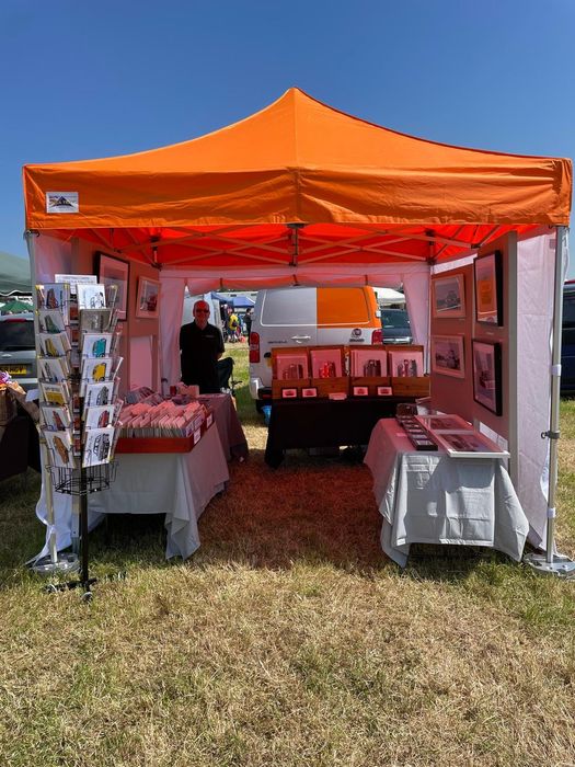 Orange gazebo at an outdoor event