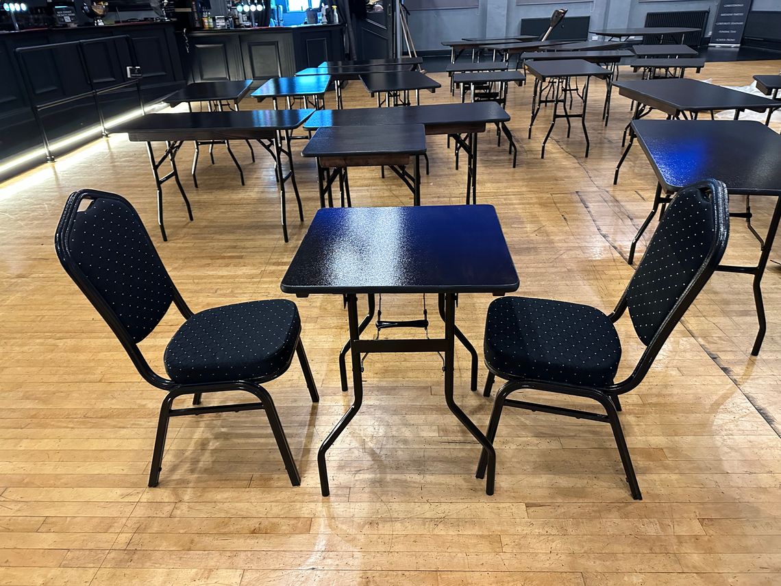 A small black table with 2 chairs
