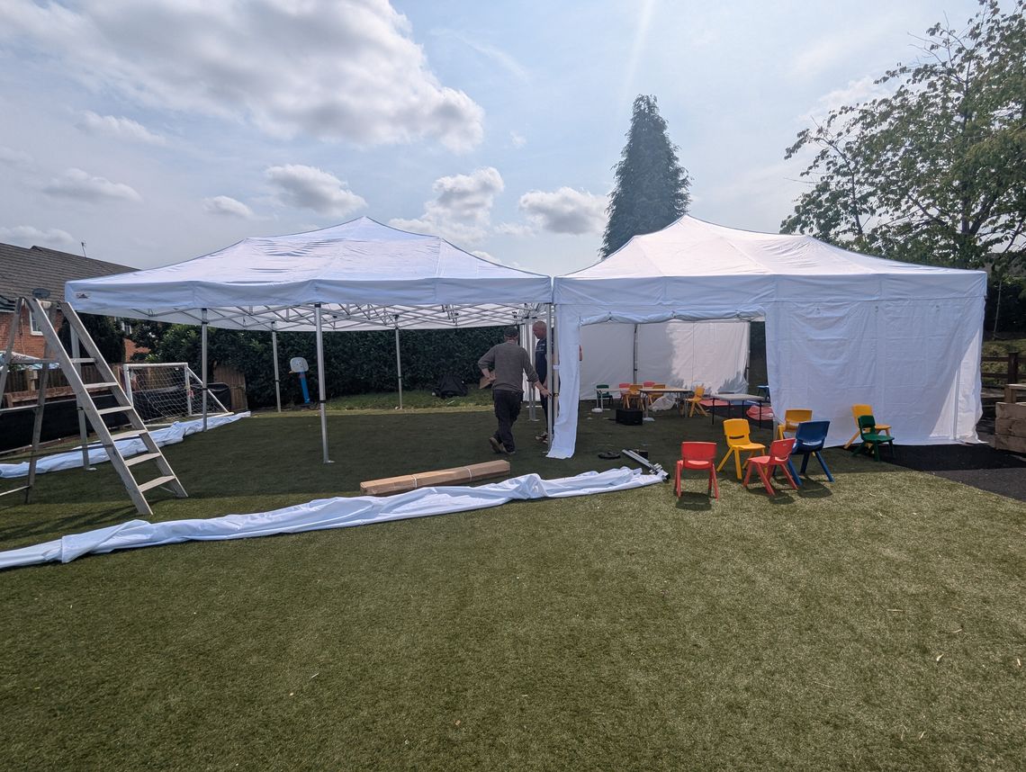 erecting hilltop tots pop up marquees